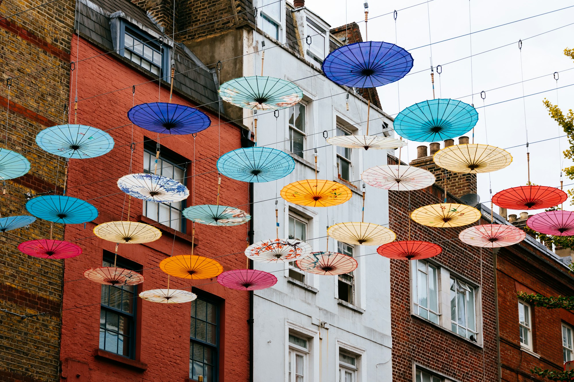 Umbrellas hanging over street in Chinatown in London